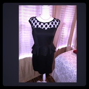 Black peplum mini dress with lace detail